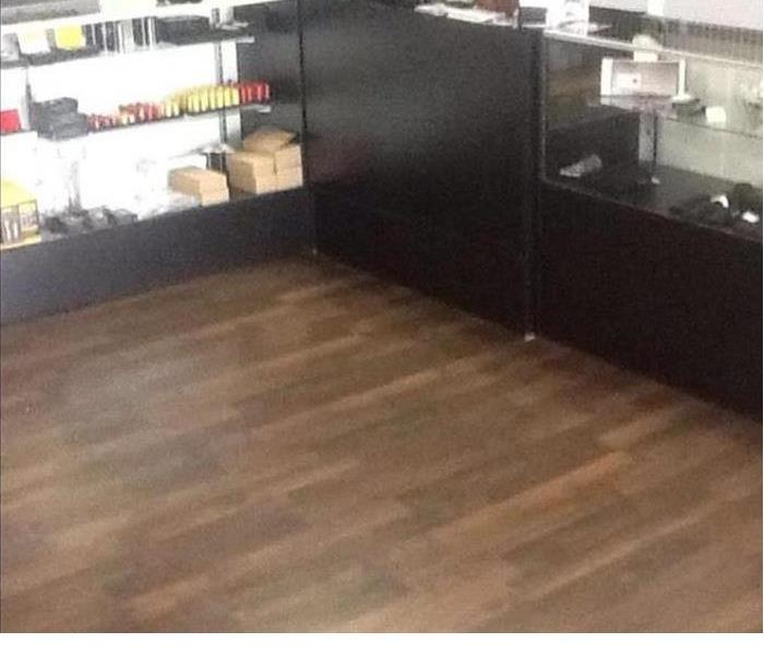 After photo of the retail store with new flooring and contents reset