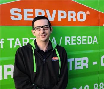 photo of male SERVPRO employee Robert Taranto in front of green background