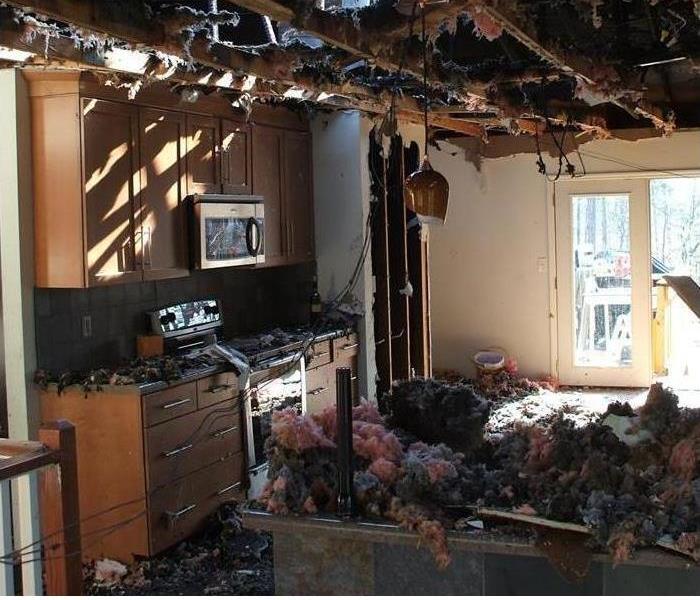 fire damaged kitchen with missing ceiling