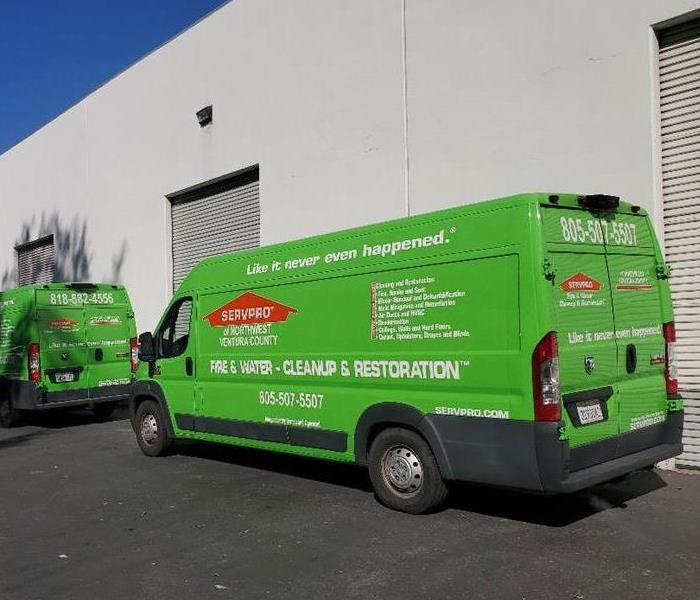 Green SERVPRO van on a job site.