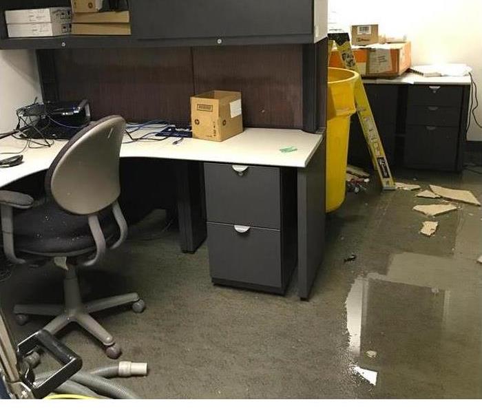 flooded office with fallen ceiling debris