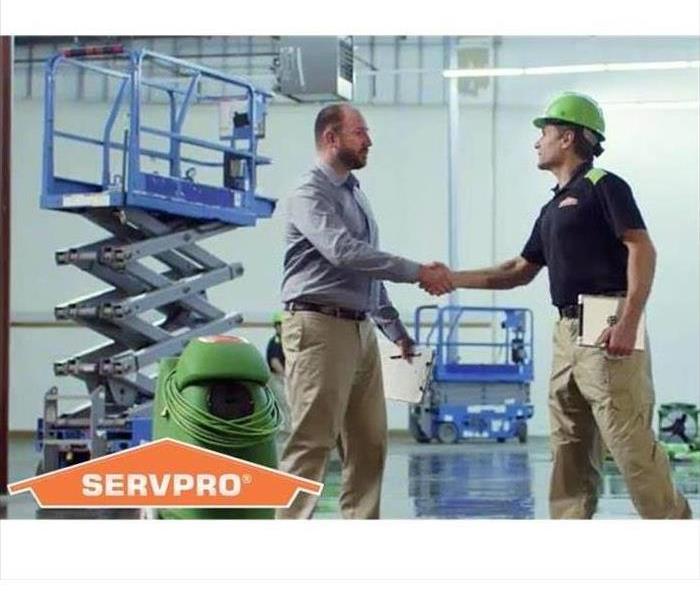 SERVPRO employee greeting commercial customer