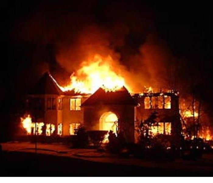flame engulfed house