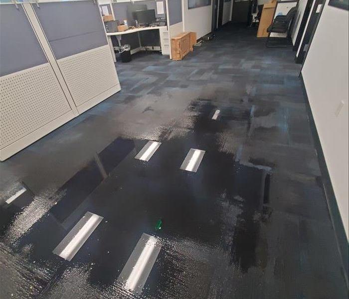 Standing water in an office.