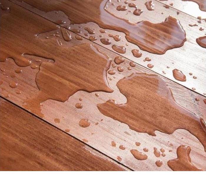 water drops on hardwood floor